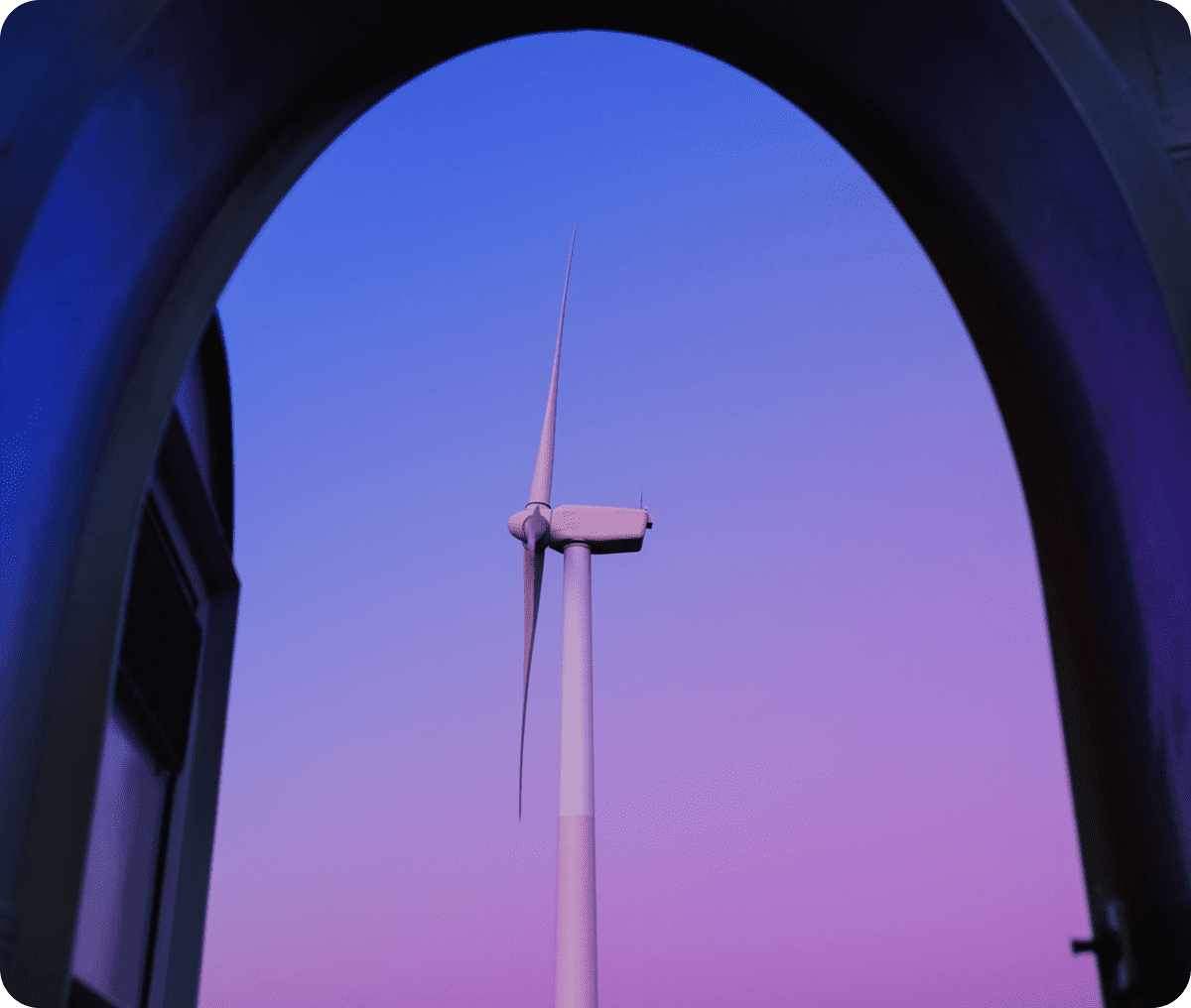 Windmill silhouette against purple sky